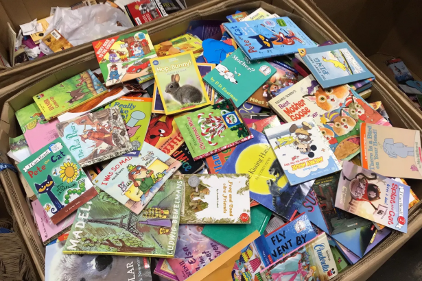 stack of colorful books every child should read before age 10