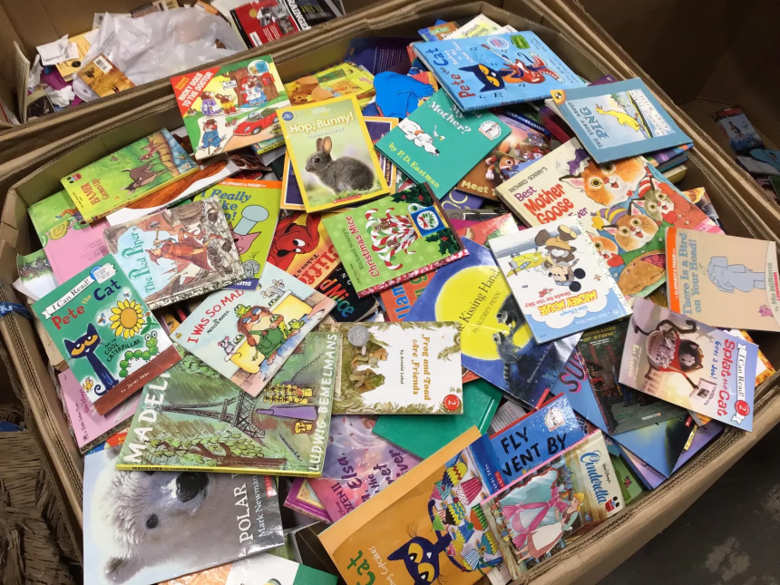 stack of colorful books every child should read before age 10
